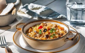 Delicious leftover risotto served with roasted vegetables on a plate