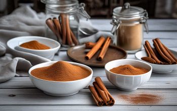 A variety of savory dishes infused with cinnamon, including tagine and spiced vegetables, on a shabby chic white table.